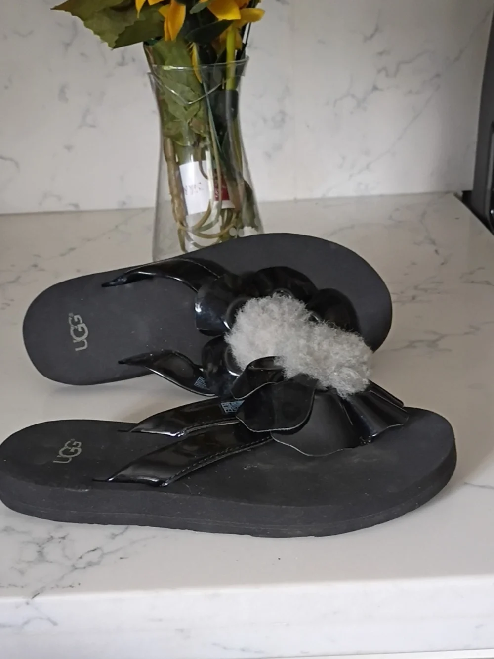 UGG  Kids  Black Shearling Flower Flip Flops